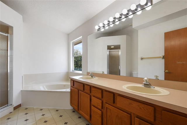 full bathroom with toilet, separate shower and tub, and a textured ceiling