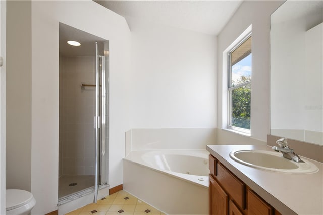 full bathroom featuring vanity, plus walk in shower, a wealth of natural light, and toilet