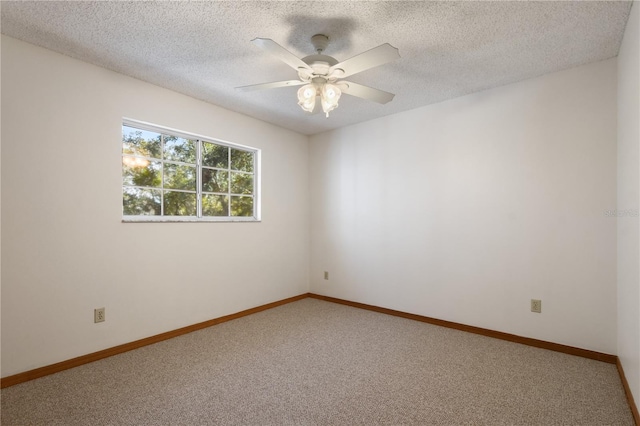 unfurnished room featuring ceiling fan, carpet, and a textured ceiling