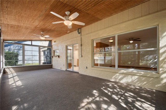 unfurnished sunroom with wooden ceiling