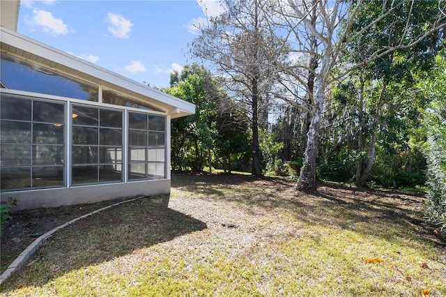 view of yard with a sunroom