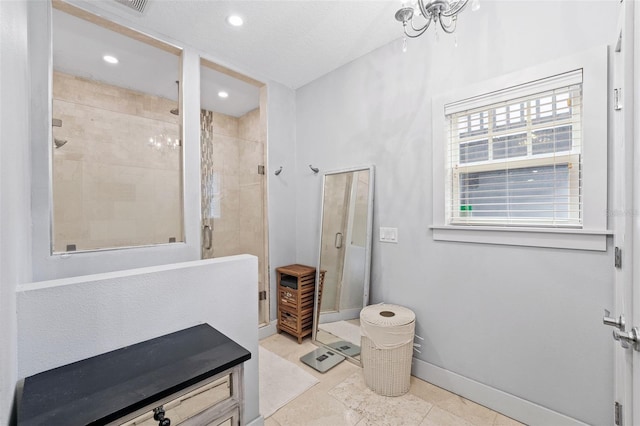 bathroom with tile patterned floors and walk in shower