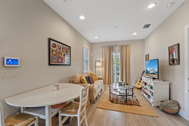 dining area with light hardwood / wood-style floors