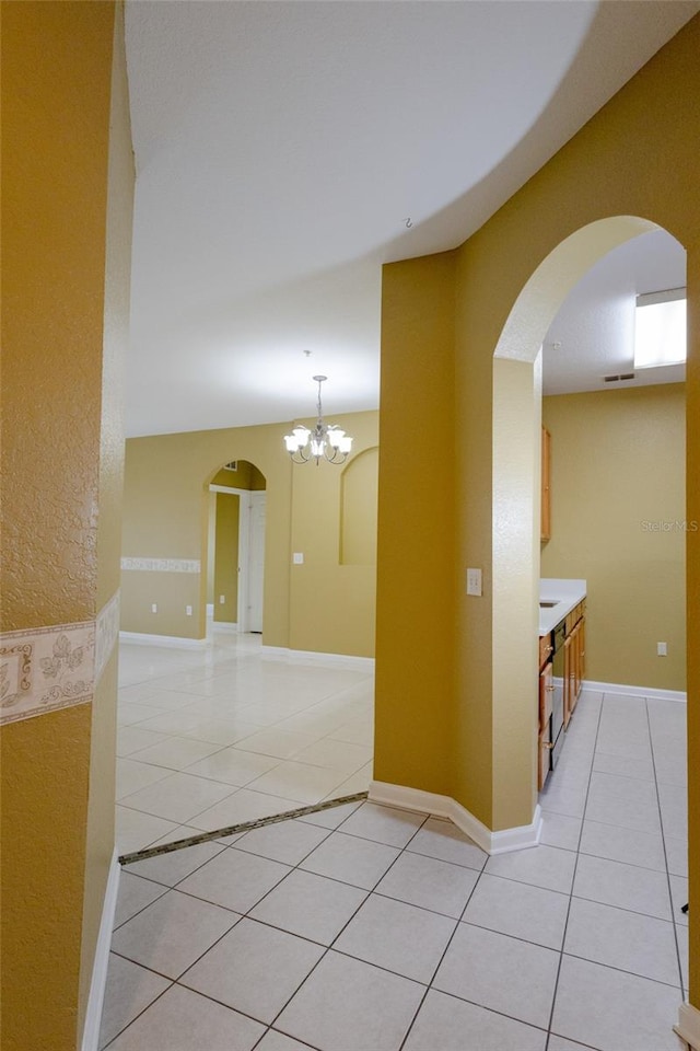 hallway with light tile patterned floors