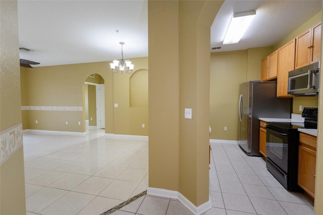 kitchen featuring pendant lighting, an inviting chandelier, light tile patterned flooring, and black electric range