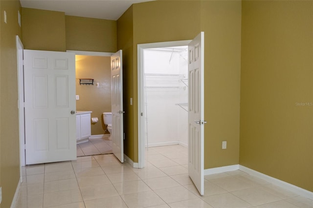 bathroom with tile patterned flooring and toilet