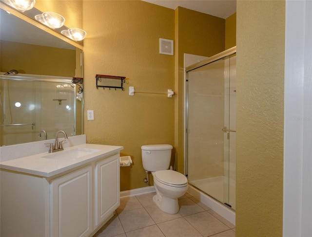 bathroom with walk in shower, tile patterned floors, toilet, and vanity