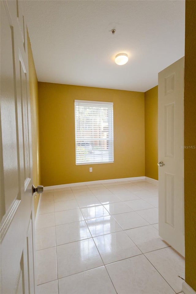 view of tiled spare room