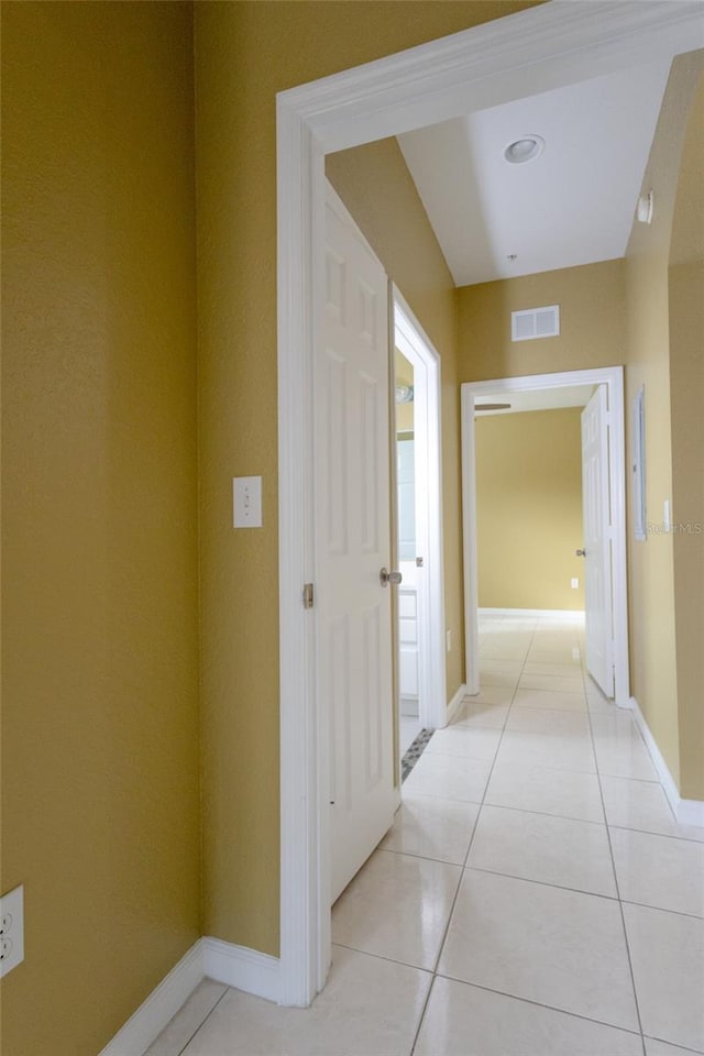 hallway with light tile patterned floors