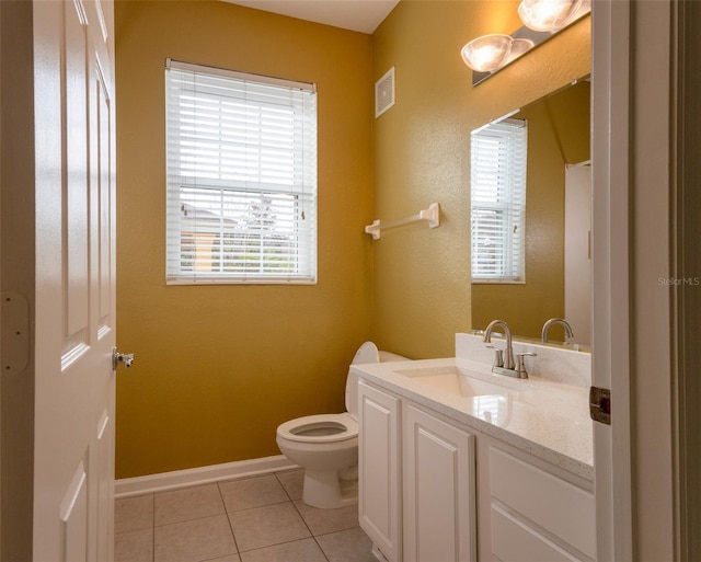 bathroom with vanity, tile patterned floors, and toilet