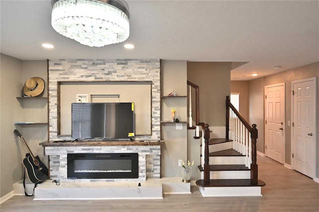 living room with hardwood / wood-style flooring and a fireplace