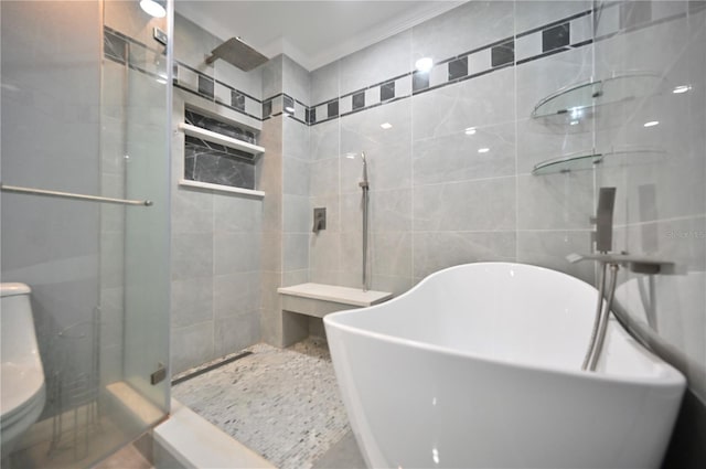 bathroom featuring plus walk in shower and tile walls