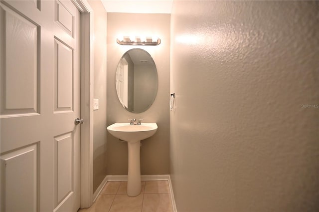 bathroom with tile patterned flooring