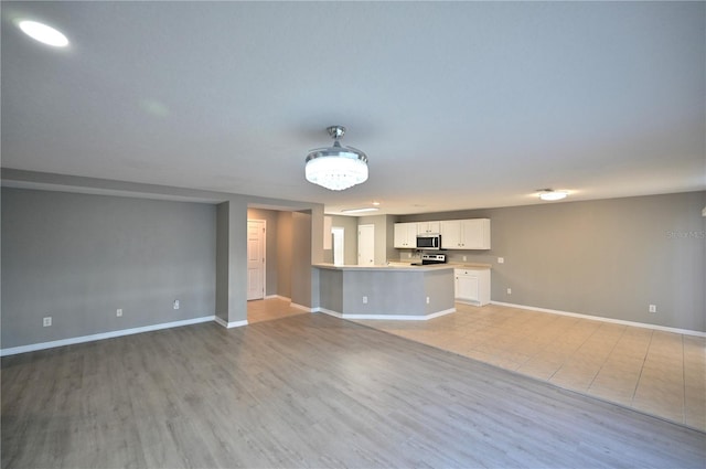 unfurnished living room featuring light hardwood / wood-style flooring