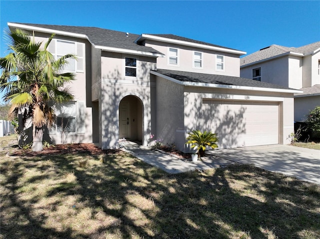 view of front of house featuring a garage and a front lawn