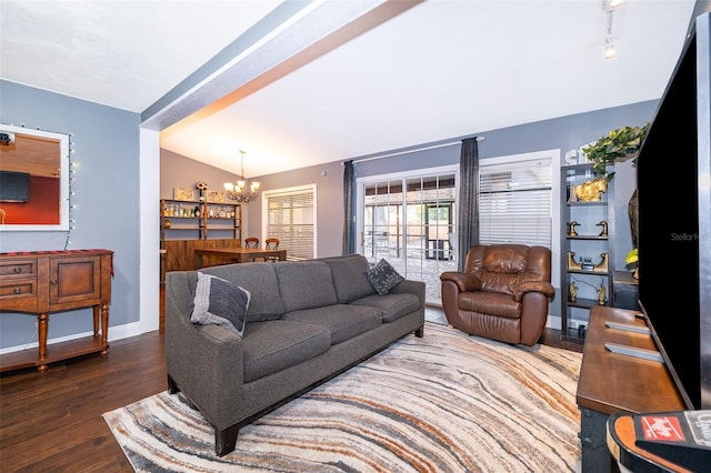 living room with vaulted ceiling, dark hardwood / wood-style floors, and a chandelier