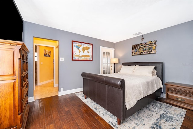 bedroom featuring dark hardwood / wood-style flooring