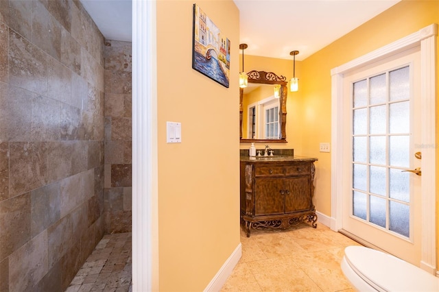 bathroom featuring vanity, toilet, and tile patterned flooring