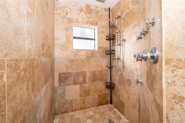 bathroom featuring tiled shower