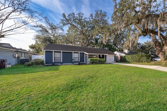 ranch-style home featuring a front yard