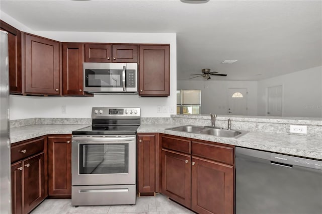 kitchen featuring sink, stainless steel appliances, and ceiling fan