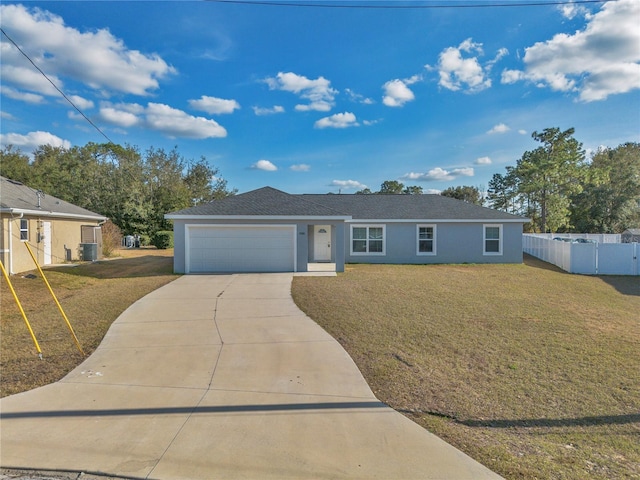 ranch-style home featuring a garage, cooling unit, and a front lawn