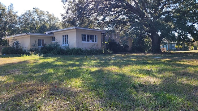 exterior space with a front lawn