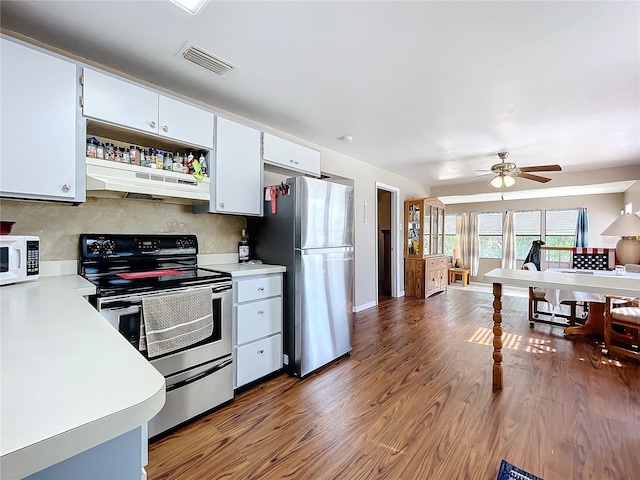 kitchen with white cabinetry, backsplash, dark hardwood / wood-style floors, and appliances with stainless steel finishes