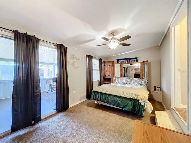 bedroom featuring access to outside, ceiling fan, and carpet