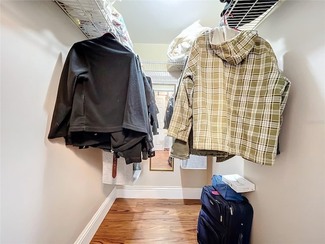 walk in closet featuring hardwood / wood-style floors