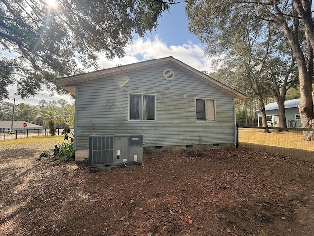 view of home's exterior with central AC