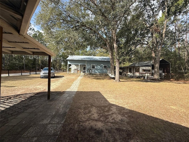 view of yard with a carport