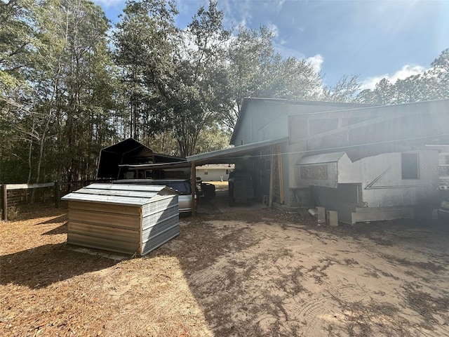 view of property exterior with an outbuilding