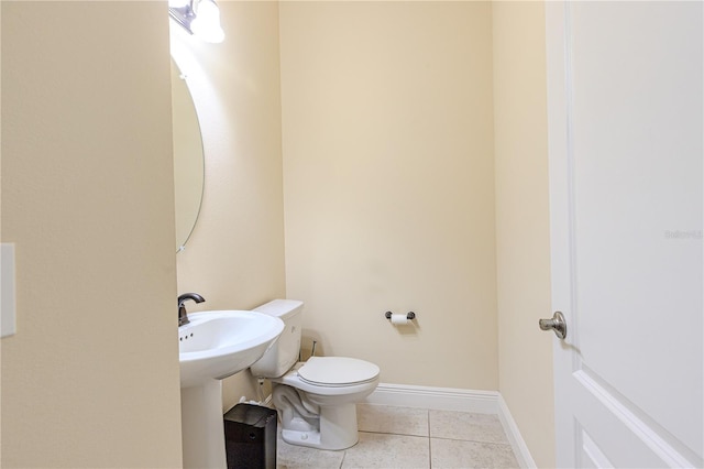 bathroom featuring tile patterned floors and toilet