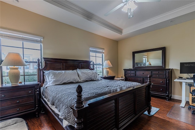 bedroom featuring ceiling fan, ornamental molding, dark hardwood / wood-style floors, and a raised ceiling