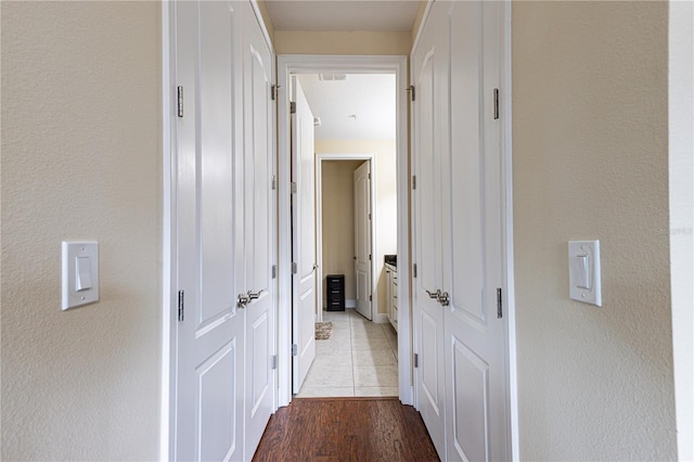 corridor featuring light hardwood / wood-style flooring