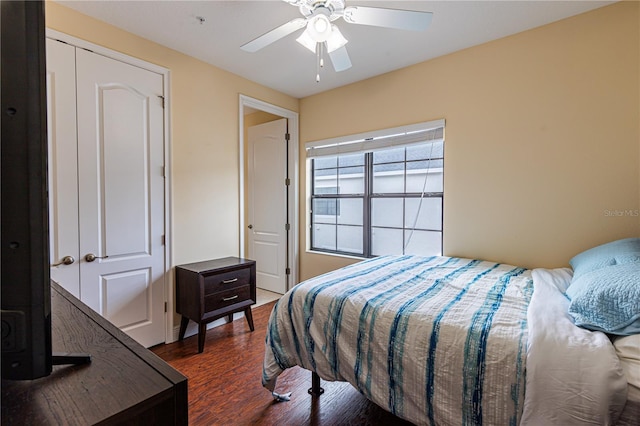 bedroom with dark wood-type flooring and ceiling fan