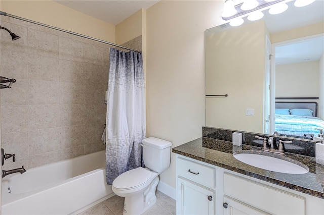 full bathroom featuring vanity, shower / tub combo, tile patterned floors, and toilet