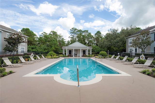 view of swimming pool with a patio