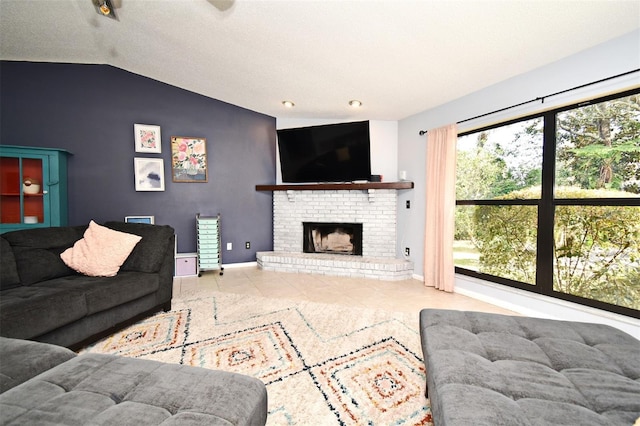 living room featuring vaulted ceiling, a brick fireplace, and light tile patterned floors