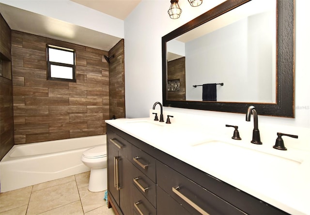 full bathroom with vanity, tiled shower / bath, tile patterned floors, and toilet