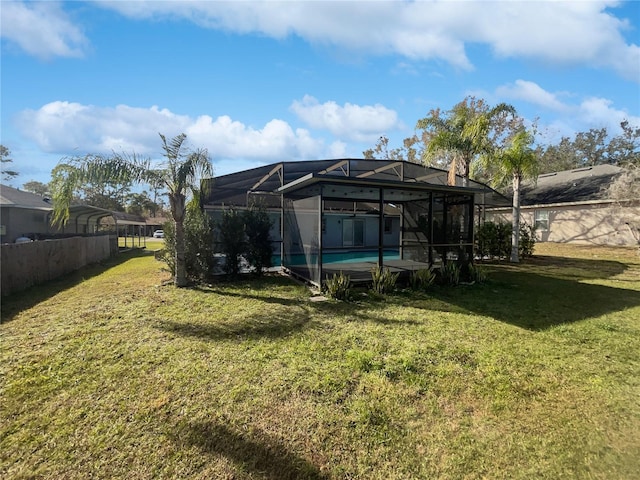 view of yard featuring a lanai and a swimming pool