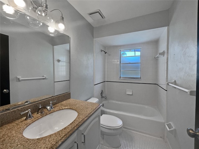 full bathroom with vanity, toilet, tiled shower / bath combo, and tile patterned flooring