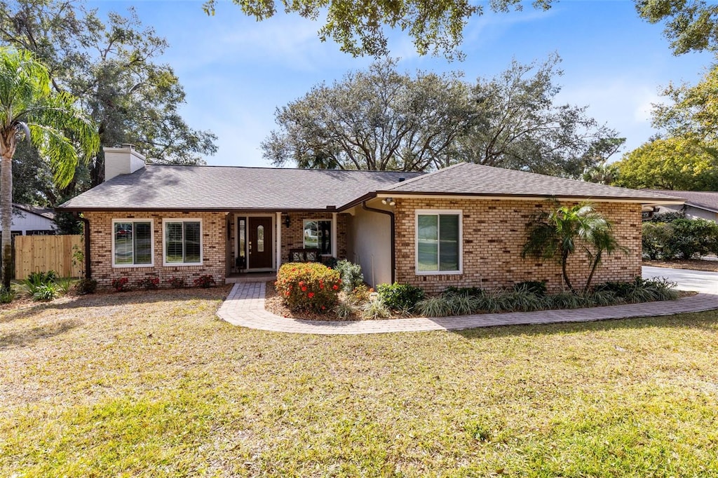 ranch-style house with a front yard