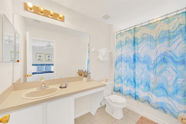 full bathroom featuring shower / tub combo with curtain, vanity, ceiling fan, toilet, and tile patterned floors