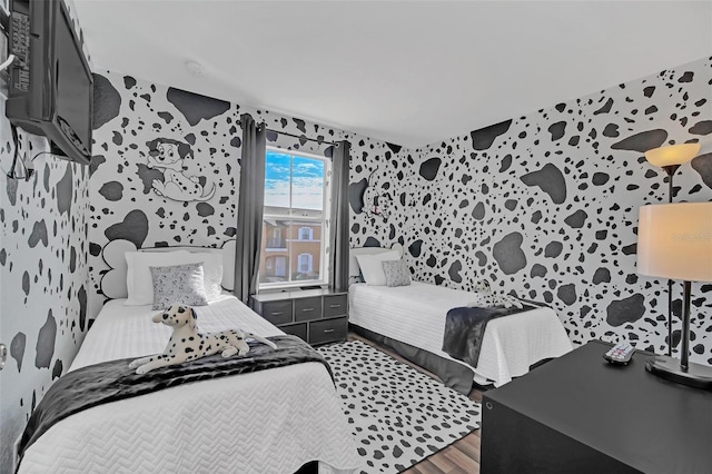 bedroom with dark hardwood / wood-style floors