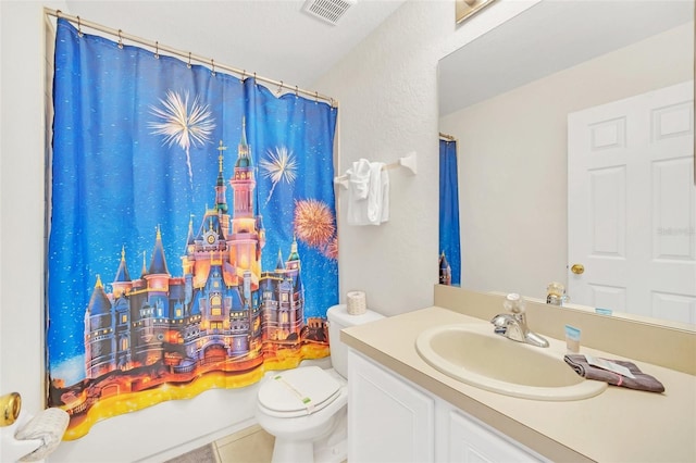 full bathroom with tile patterned floors, vanity, toilet, and shower / bath combo