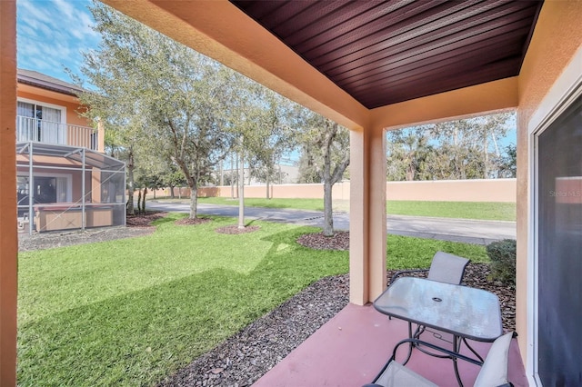 view of patio / terrace with a lanai