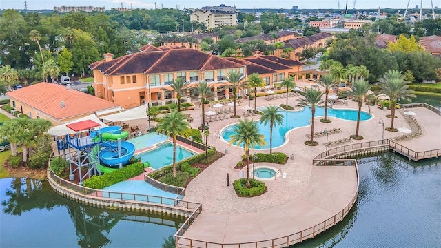 birds eye view of property with a water view