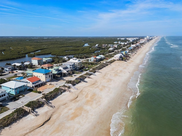 bird's eye view with a beach view and a water view